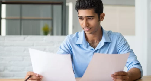 concentrated-male-manager-attentively-viewing-document (1)